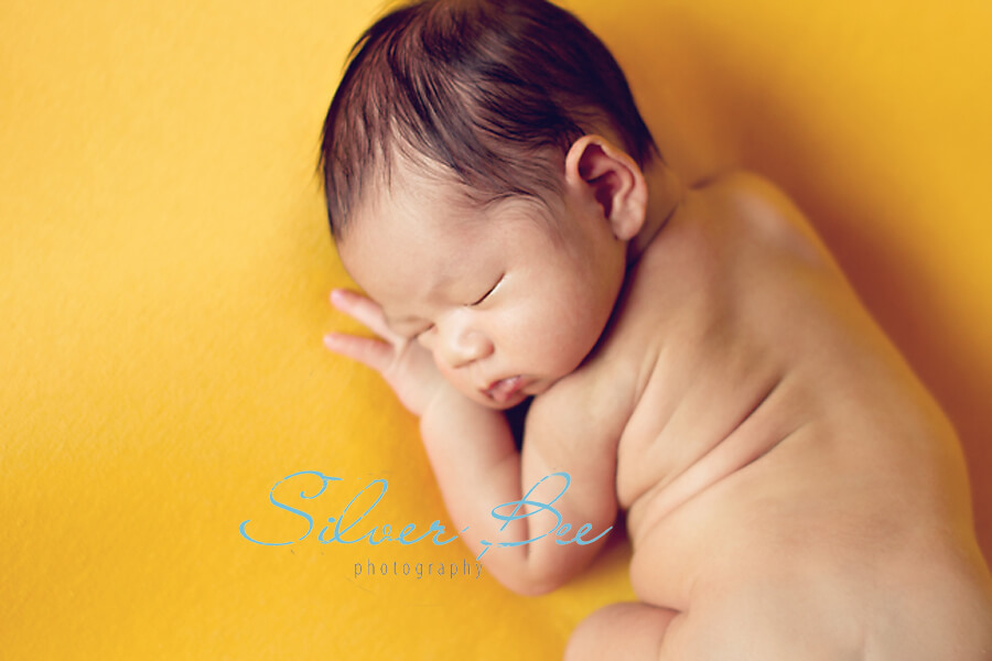 baby sleeping on beanbag fabric