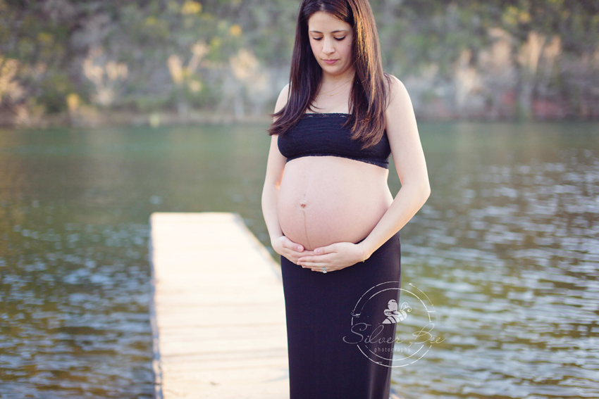 Lake Austin Maternity Photography Session with black bandeau and black skirt on lake pier dock.