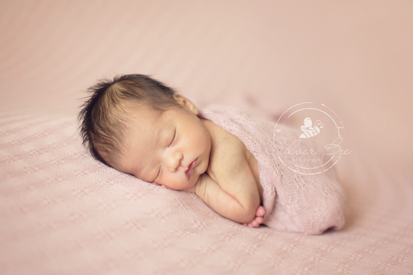 Newborn baby photographer Austin Texas with baby girl photo session at one week old.