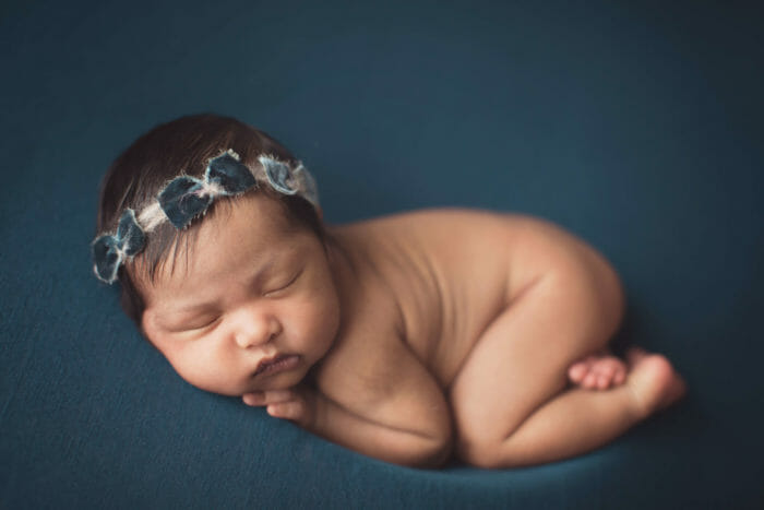 Using blue backdrop for newborn baby girls | Silver Bee Photography