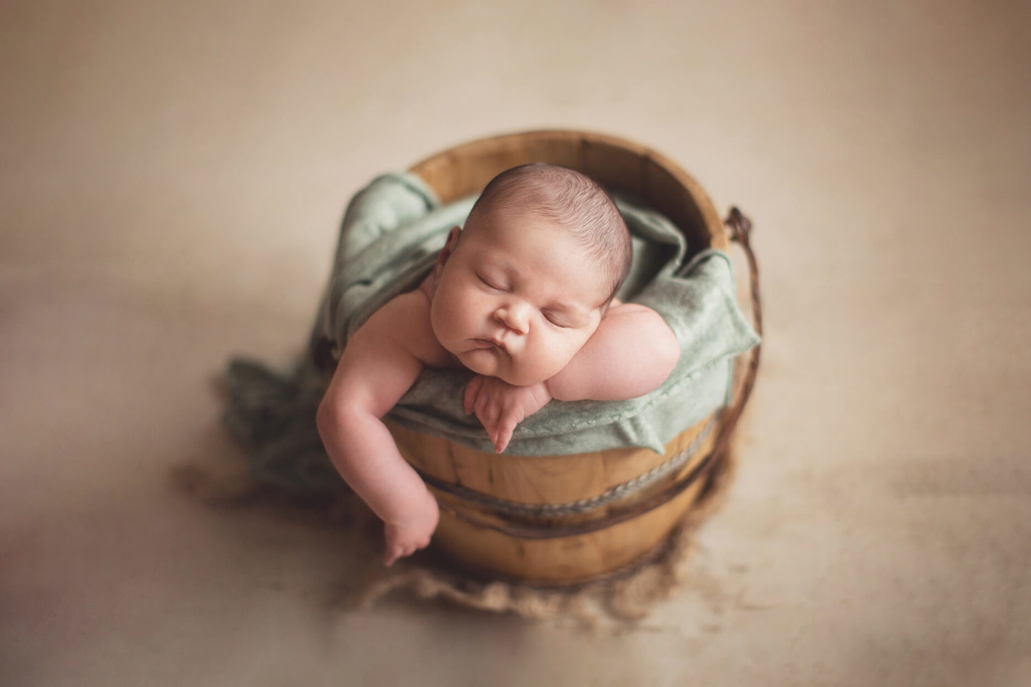 How to pose newborn baby in bucket