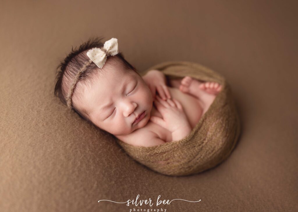 Fall colors for newborn baby photography session.